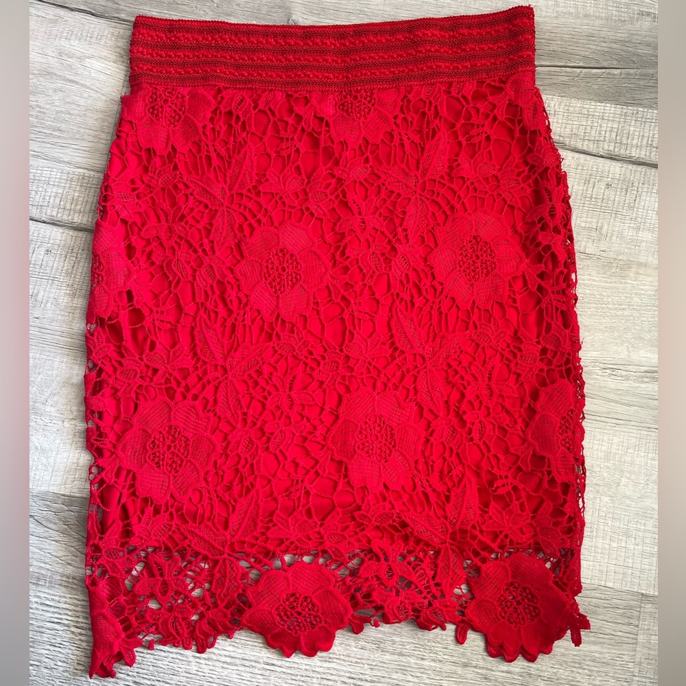 Red pencil skirt with beautiful lace detail. Fits sizes 14/16.